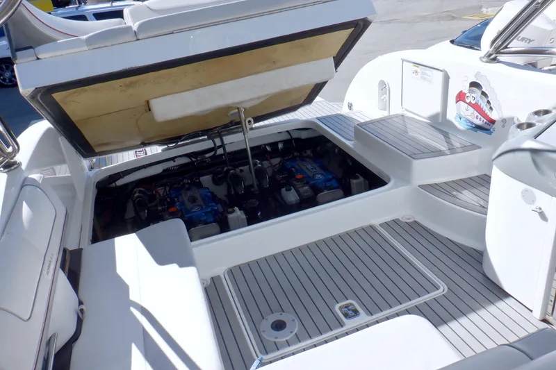 Slide: The Image of 2015 Formula 350 Crossover Bowrider interior with white seating and cup holders. - 7