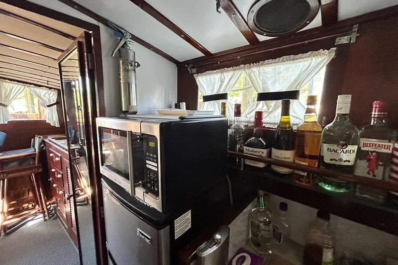 Slide: The Image of Interior of a 1930 Classic 47' ACF boat with kitchen and bar area. - 22