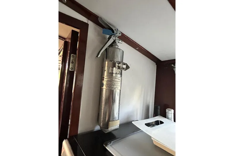 Slide: The Image of Wall-mounted fire extinguisher inside a 1930 Classic 47' ACF vehicle interior. - 30