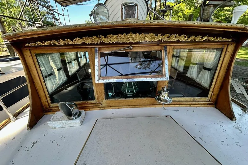 Slide: The Image of 1930 Classic 47' ACF boat cabin with ornate woodwork and vintage design elements. - 32