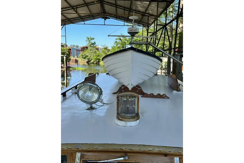 Slide: The Image of Classic 1930 47' ACF boat under a canopy, featuring vintage design elements. - 33