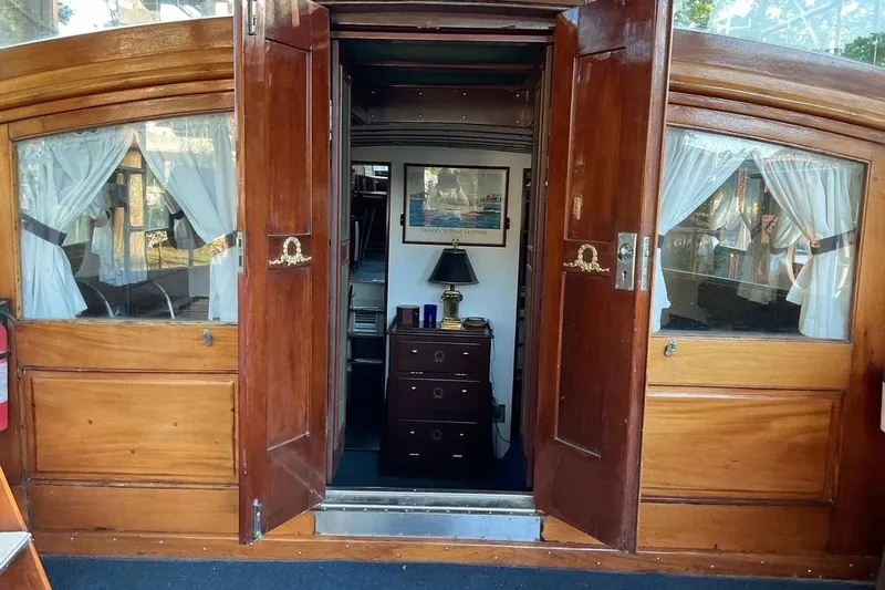 Slide: The Image of Interior view of a 1930 Classic 47' ACF boat with wooden doors and elegant decor. - 5