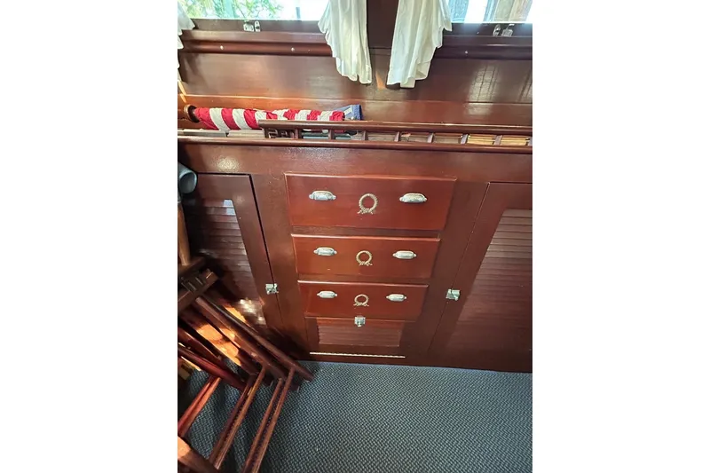 Slide: The Image of Wooden interior of a 1930 Classic 47' ACF boat with drawers and nautical decor. - 9