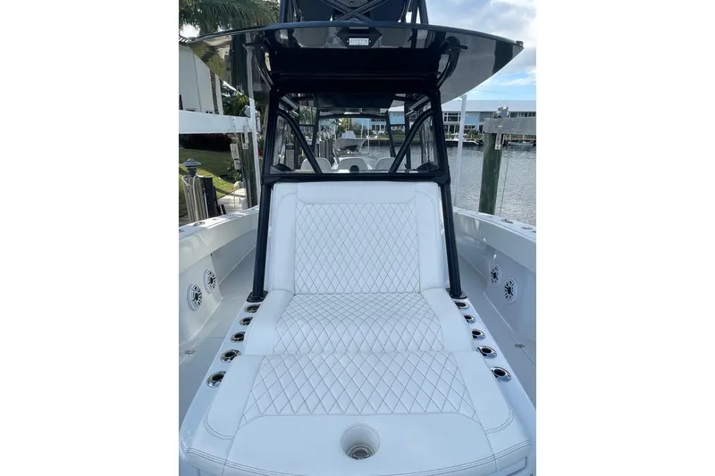 Slide: The Image of 2023 Conch 41 Center Console boat with luxurious white seating and sleek design. - 10