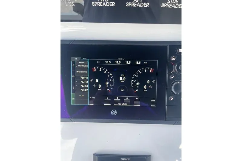 Slide: The Image of Dashboard display of 2023 Conch 41 Center Console boat showing engine metrics. - 12