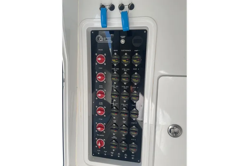 Slide: The Image of Control panel of 2023 Conch 41 Center Console boat with switches and labels. - 15