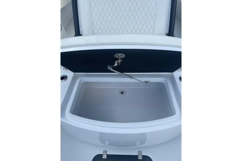 Slide: The Image of 2023 Conch 41 Center Console boat sink with faucet and storage compartment. - 17