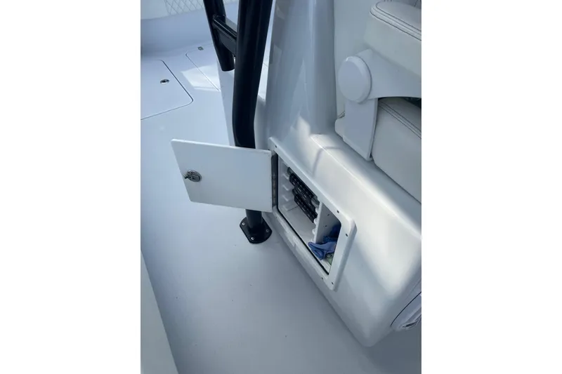 Slide: The Image of 2023 Conch 41 Center Console interior storage compartment with open door. - 25