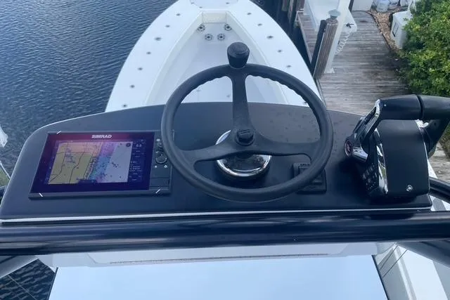 Slide: The Image of 2023 Conch 41 Center Console helm with navigation display and steering wheel. - 3