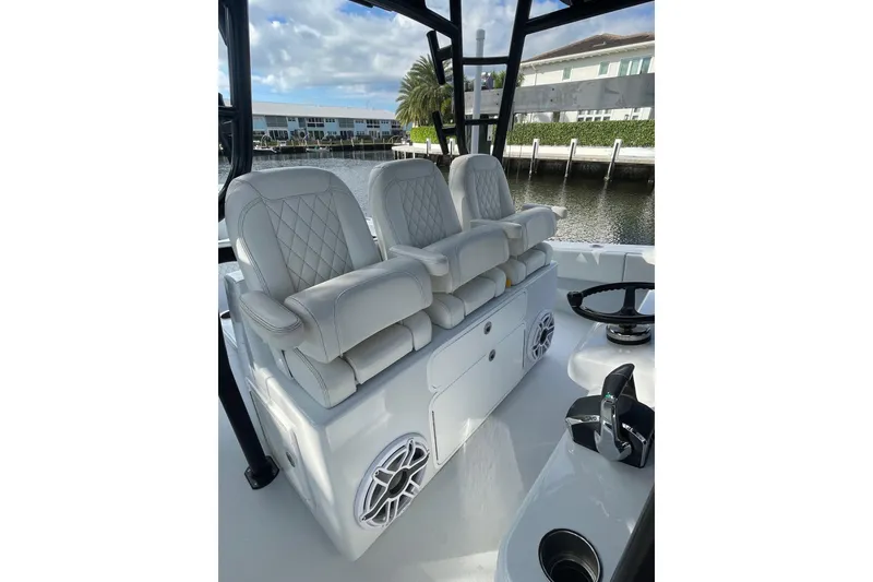 Slide: The Image of Luxurious seating on 2023 Conch 41 Center Console boat, featuring elegant white upholstery. - 30