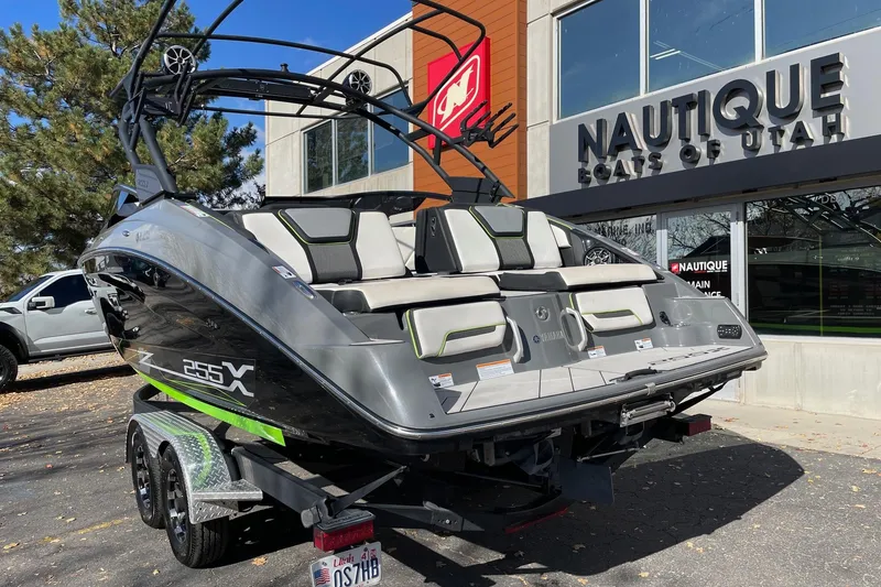 Slide: The Image of 2021 Yamaha Boats 255XD displayed outside Nautique Boats of Utah dealership. - 3