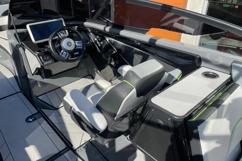 Slide: The Image of 2021 Yamaha Boats 255XD cockpit with modern steering and seating. - 6