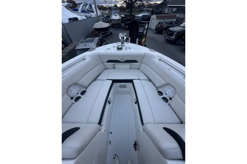 Slide: The Image of 2021 Sailfish 245DC boat interior with white seating and cup holders. - 19