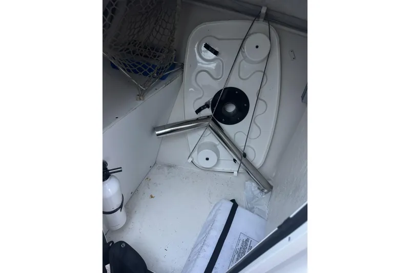Slide: The Image of Interior of a 2021 Sailfish 245DC boat showing storage area and equipment. - 29