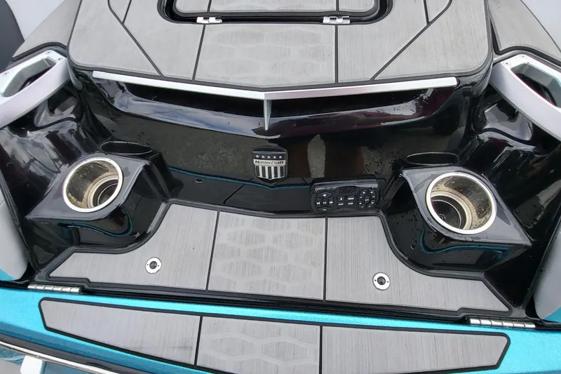 Slide: The Image of 2022 MasterCraft X24 boat stern with cup holders and control panel. - 4