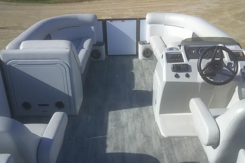 Slide: The Image of 2021 Crest Classic LX 220 SLC boat interior with modern seating and control panel. - 13