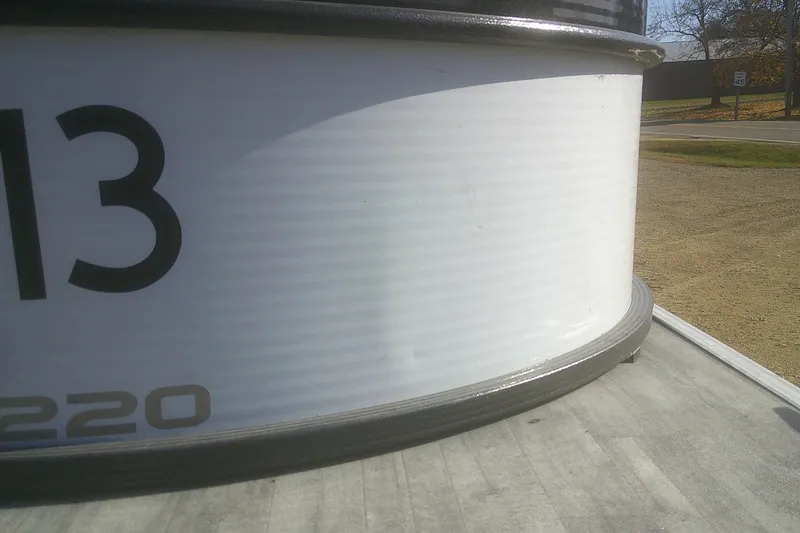 Slide: The Image of 2021 Crest Classic LX 220 SLC boat detail with partial view of number 13. - 22