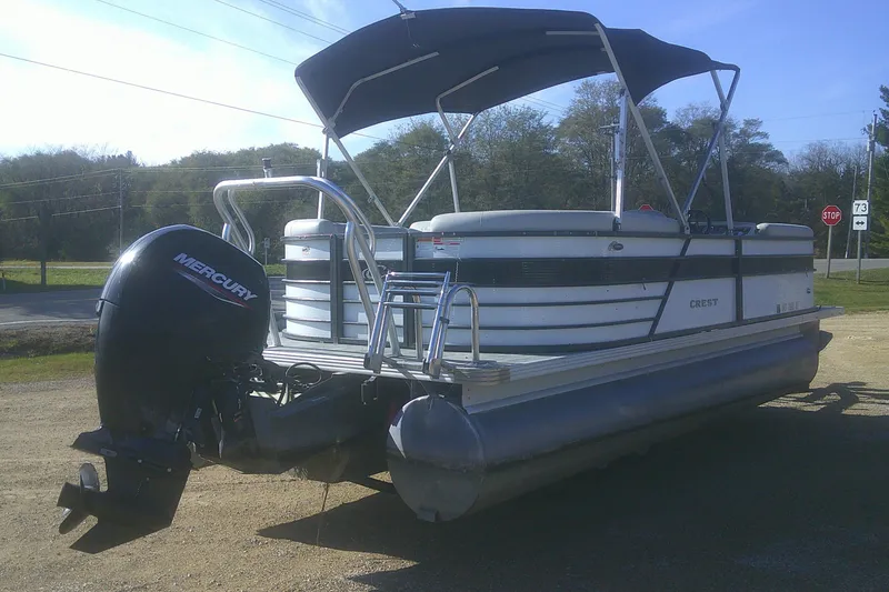 Slide: The Image of 2021 Crest Classic LX 220 SLC pontoon boat with Mercury outboard motor. - 3