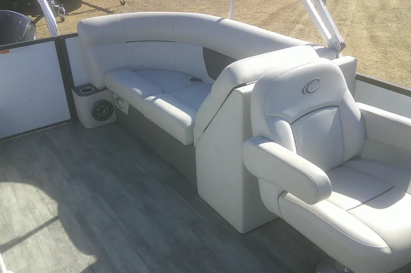 Slide: The Image of 2021 Crest Classic LX 220 SLC boat interior with plush seating and modern design. - 6