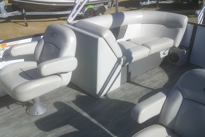 Slide: The Image of 2021 Crest Classic LX 220 SLC boat interior with plush seating and modern design. - 7
