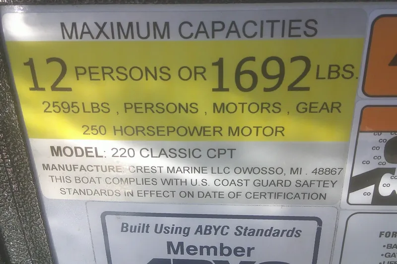 Slide: The Image of 2021 Crest Classic LX 220 SLC capacity label, 12 persons or 1692 lbs, 250 horsepower. - 8