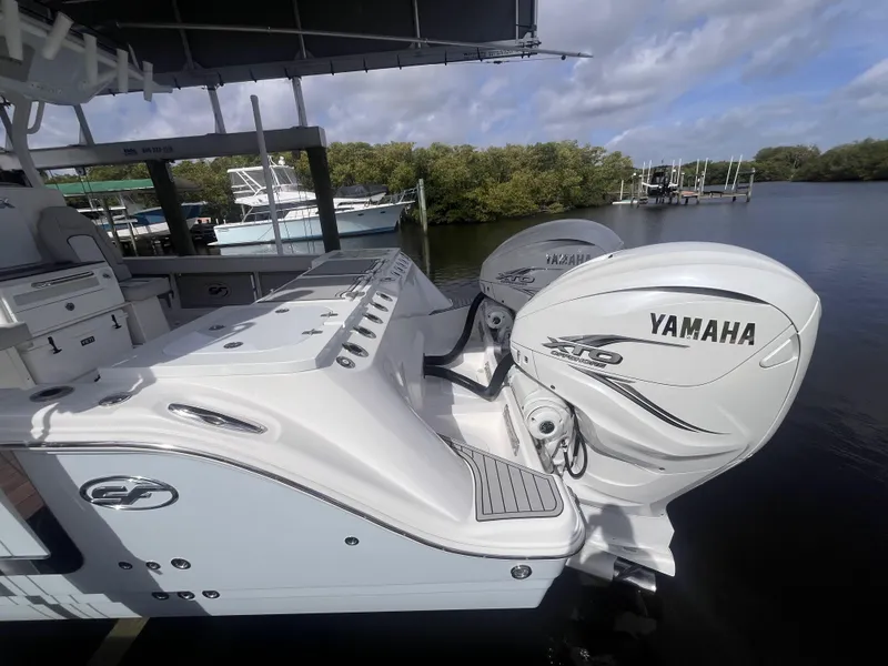 Slide: The Image of 2021 Sea Fox 368 Commander with Yamaha outboard engines docked by the water. - 11