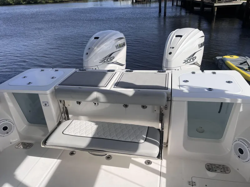 Slide: The Image of 2021 Sea Fox 368 Commander boat with Yamaha engines, featuring a spacious deck and seating area. - 21