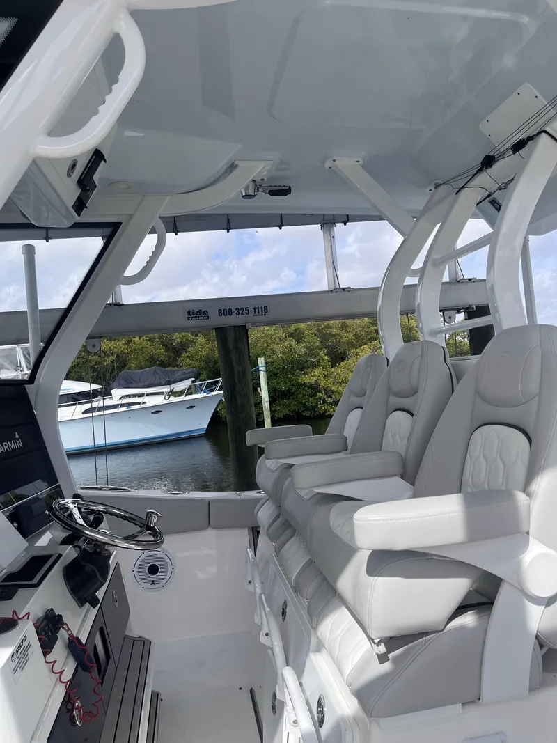 Slide: The Image of 2021 Sea Fox 368 Commander boat interior with plush seating and modern controls. - 31