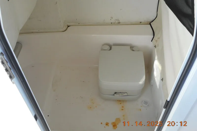 Slide: The Image of 2024 Sea Fox 248 Commander boat interior with portable toilet. - 18