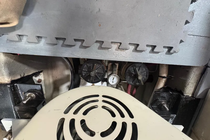 Slide: The Image of Engine compartment of a 2001 Monk Trawler with visible gauge and components. - 100