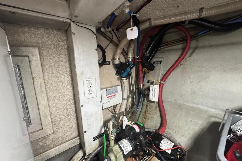 Slide: The Image of Electrical wiring and components inside a 2001 Monk Trawler boat. - 105