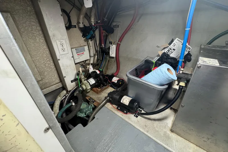 Slide: The Image of Engine room of a 2001 Monk Trawler with tools and equipment. - 107