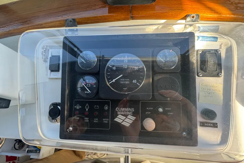 Slide: The Image of Control panel of a 2001 Monk Trawler boat with Cummins Marine gauges. - 14