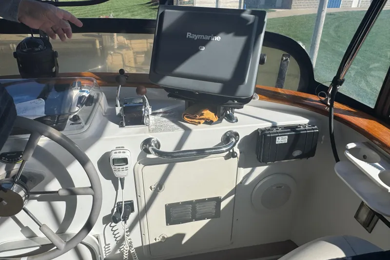 Slide: The Image of Helm of 2001 Monk Trawler with Raymarine navigation system and controls. - 17