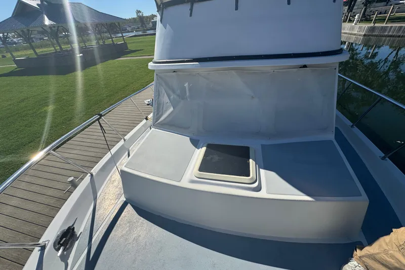 Slide: The Image of 2001 Monk Trawler boat deck with hatch, docked near grassy area and pavilion. - 29