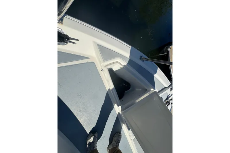 Slide: The Image of Deck view of a 2001 Monk Trawler boat with open storage compartment. - 30