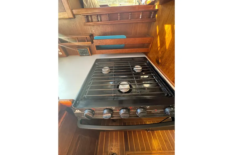 Slide: The Image of Stove in 2001 Monk Trawler kitchen with wooden cabinetry. - 42