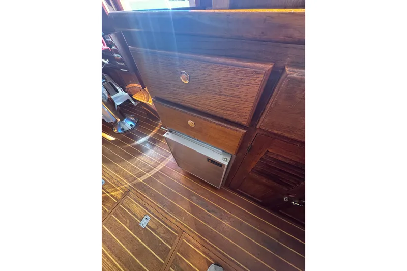Slide: The Image of Wooden interior of 2001 Monk Trawler with drawers and flooring. - 48