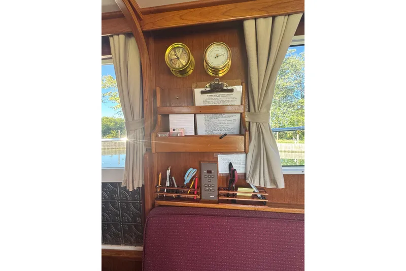 Slide: The Image of Interior of 2001 Monk Trawler with nautical instruments and organized tools. - 51