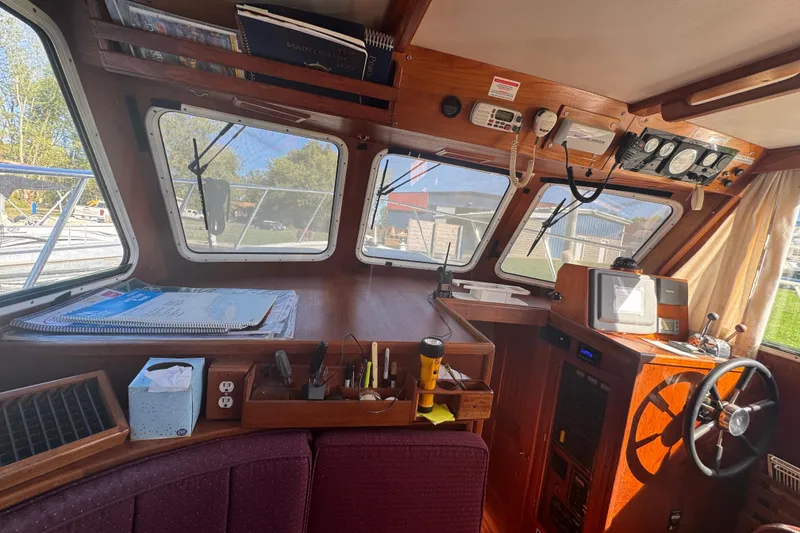 Slide: The Image of 2001 Monk Trawler interior with navigation equipment and wooden dashboard. - 53