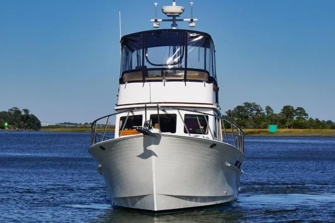Slide: The Image of 2001 Monk Trawler boat on calm water, clear sky background. - 6
