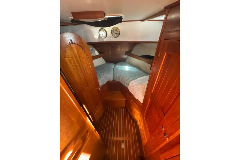 Slide: The Image of Cozy cabin interior of 2001 Monk Trawler with wooden finish and twin beds. - 62
