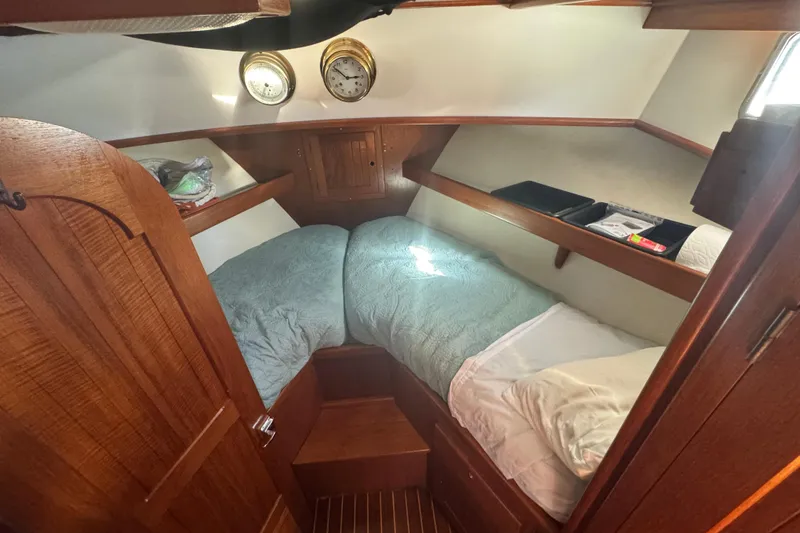 Slide: The Image of Cozy cabin interior of 2001 Monk Trawler with wooden finish and twin beds. - 63