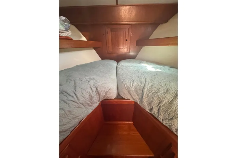 Slide: The Image of Cozy cabin interior of 2001 Monk Trawler with twin beds and wooden accents. - 70