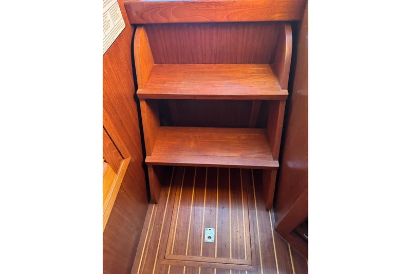 Slide: The Image of Wooden steps inside a 2001 Monk Trawler, showcasing rich wood grain and craftsmanship. - 72