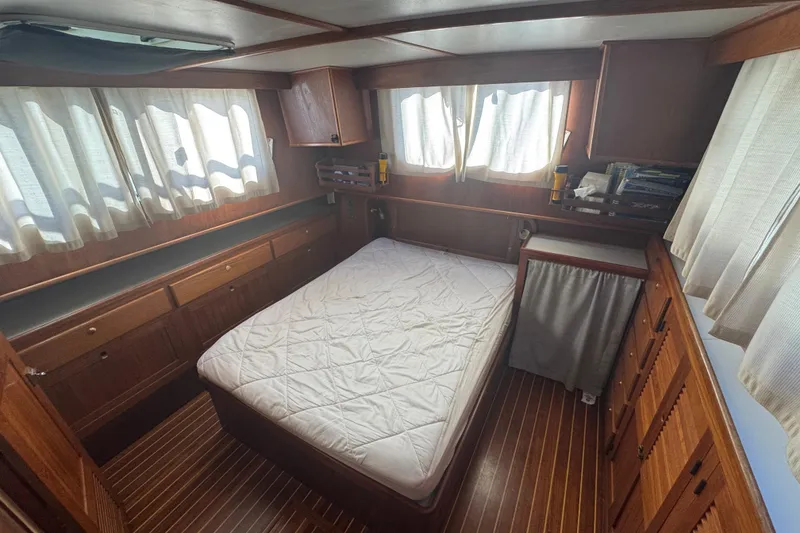 Slide: The Image of Cozy cabin interior of 2001 Monk Trawler with wood paneling and bed. - 79