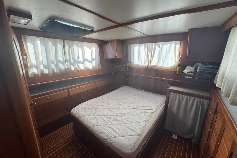 Slide: The Image of Cozy cabin interior of 2001 Monk Trawler with wood paneling and bed. - 80