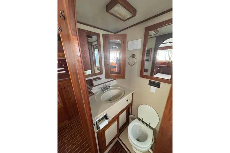 Slide: The Image of Bathroom interior of 2001 Monk Trawler with wooden accents and mirror. - 89