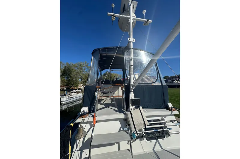 Slide: The Image of 2001 Monk Trawler boat docked under clear blue sky. - 9