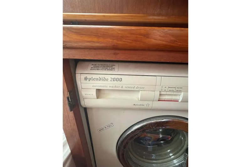 Slide: The Image of Splendide 2000 washer-dryer in 2001 Monk Trawler, wooden cabinet setting. - 94